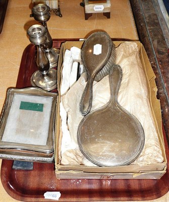 Lot 309 - Two silver photograph frames, a pair of silver candlesticks and silver backed dressing table items