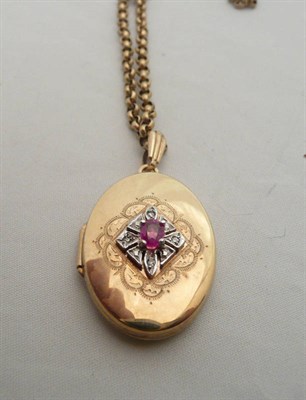 Lot 337 - A 9 carat gold, ruby and diamond locket on a 9 carat gold belcher necklace,10.1g approx.