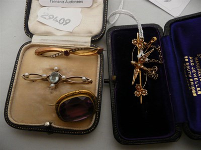 Lot 347 - A seed pearl swallow bar brooch, two other bar brooches and another brooch (4)