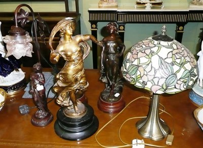 Lot 443 - Four spelter figures, a figural lamp and a stained glass lamp