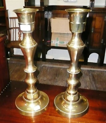 Lot 448 - A large pair of brass candlesticks