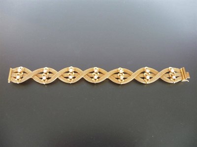 Lot 293 - A Seed Pearl Set Bracelet, clustered foxtail link chains in a plaited sequence are held in place by