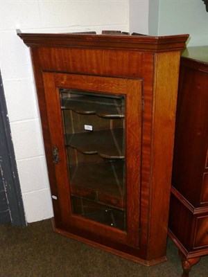 Lot 561 - Oak glazed corner cupboard