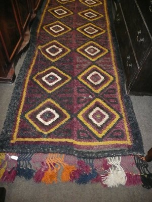 Lot 569 - Purple ground fringed runner