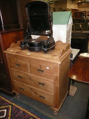 Lot 577 - Pine chest of drawers, a toilet mirror and a revolving bookcase