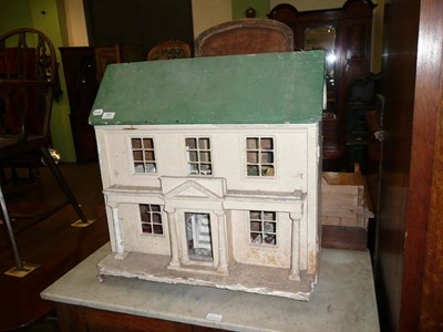 Lot 584 - Painted pine dolls house