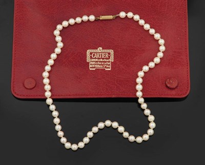 Lot 298 - A Single Row Cultured Pearl Necklace, by Cartier, the sixty-one uniform pearls of pink-cream...