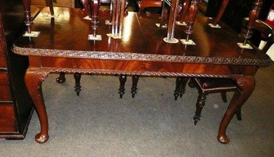 Lot 590 - 20th century mahogany dining table