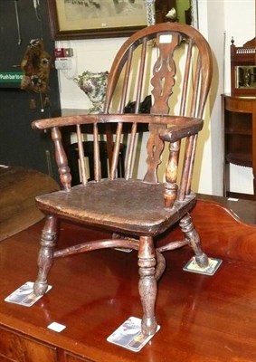 Lot 609 - Child's yew Windsor chair with crinoline stretcher