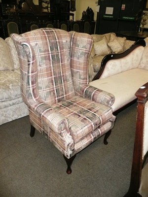 Lot 613 - Upholstered wing back chair