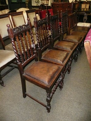 Lot 616 - Set of four oak dining chairs and a rocking chair