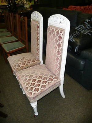 Lot 630 - Pair of white painted gilt Victorian high back chairs