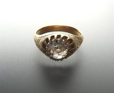 Lot 304 - A Rose Cut Diamond Solitaire Ring, the diamond held in a white claw setting to engraved yellow...