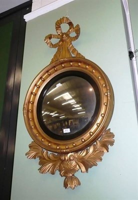 Lot 672 - Gilt convex mirror