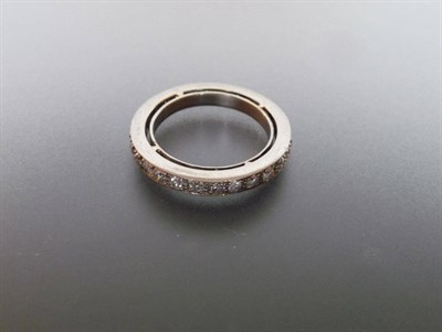 Lot 314 - A Diamond Full Eternity Ring, old cut diamonds in white claw settings to a solid plain mount...