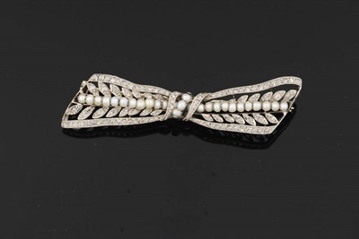 Lot 315 - A Seed Pearl and Diamond Bow Shaped Brooch, the stylised bow set with rose cut diamonds, a line...