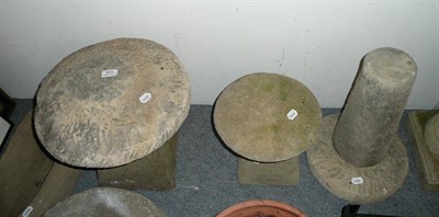 Lot 820 - Two stradle re-constituted garden ornaments and two bird bath bases and other stone items