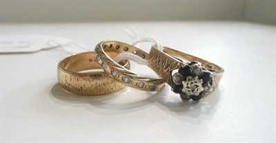 Lot 2 - A 9ct gold sapphire and diamond cluster ring, a 9ct gold band ring and a 9ct gold stone-set ring