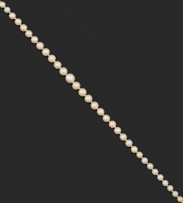 Lot 323 - A Single Strand of Graduated Seed Pearls, circa 1910, the golden cream coloured pearls graduate...