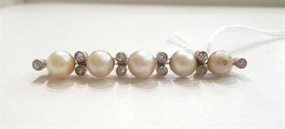 Lot 32 - A cultured pearl and diamond bar brooch, five slightly graduated cultured pearls spaced by pairs of