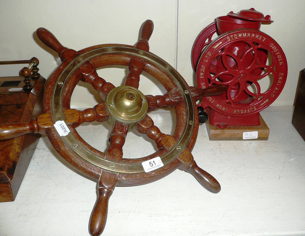 Lot 51 - A ship's wheel by Simpson & Lawrence, circa 1940 and a cast iron coffee grinder by Suffolk Iron...