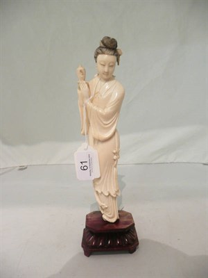 Lot 61 - A Japanese ivory figure on stand, circa 1940