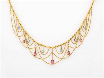 Lot 329 - An Aquamarine, Pink Topaz and Seed Pearl Necklace, six round cut aquamarines in collet settings...