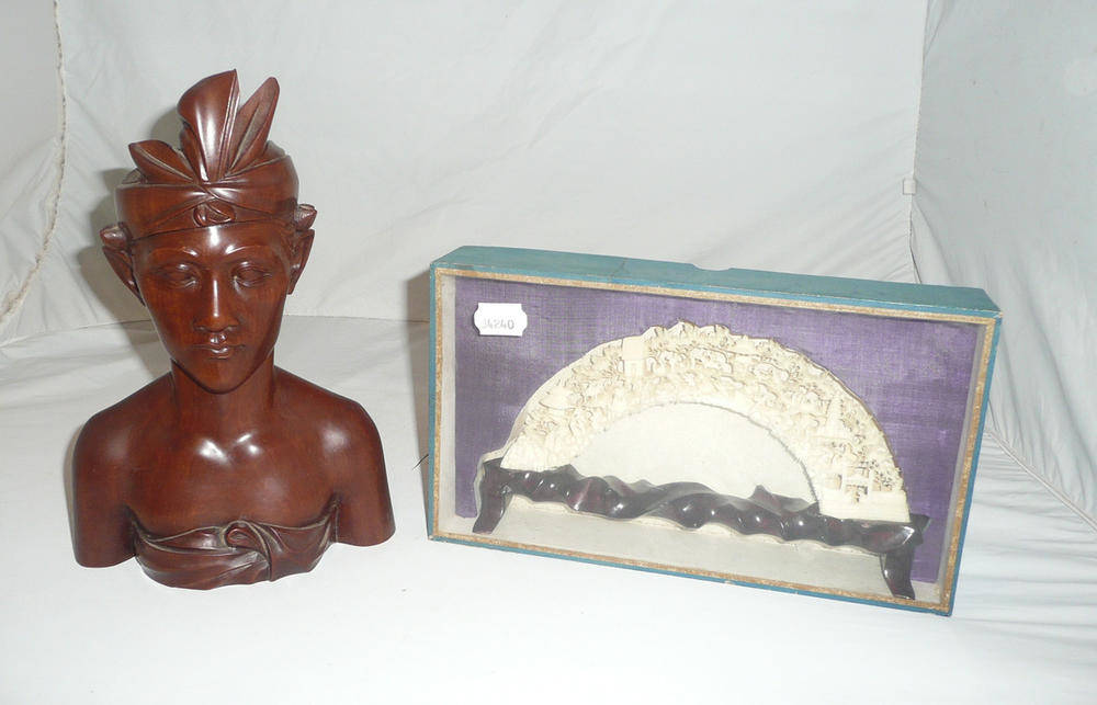 Lot 93 - Carved hardwood bust and a carved bone ornament on hardwood stand