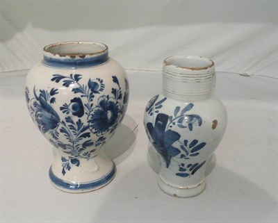 Lot 99 - 18th century tin glaze Rhinish beer jug with an 18th century Dutch Delft floral vase