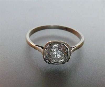 Lot 334 - A Diamond Solitaire Ring, the round brilliant cut diamond in a squared rub over mount to a...