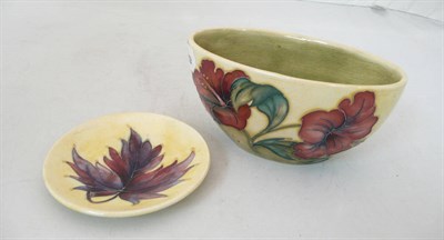 Lot 141 - A Moorcroft yellow ground small planter and a Moorcroft yellow ground plate