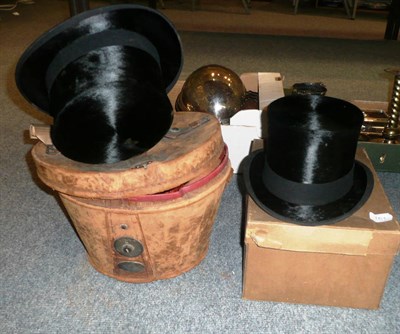 Lot 161 - A leather hat box, two top hats and a box of white linen