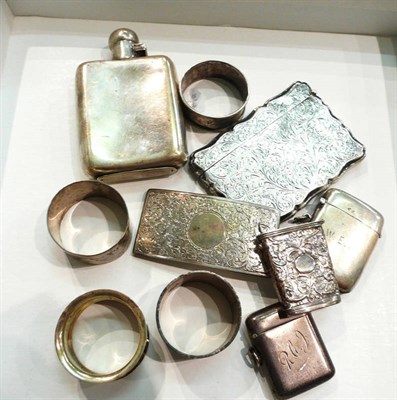 Lot 194 - A silver hip flask, two silver card cases, two silver vesta cases, silver napkin rings, etc, 12 oz