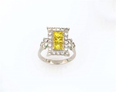 Lot 341 - An 18 Carat White Gold Yellow and White Diamond Ring, three princess cut yellow coloured...