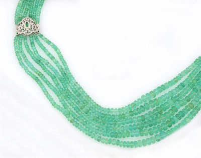 Lot 342 - An Emerald and Diamond Necklace, six rows of graduated faceted emerald beads sit with two...