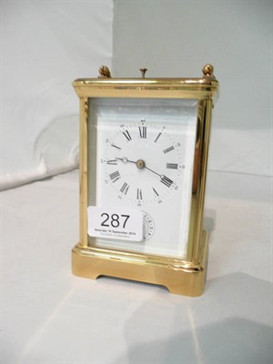 Lot 287 - A brass alarm carriage clock