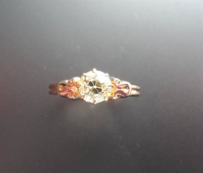 Lot 351 - A Diamond Solitaire Ring, a round brilliant cut diamond in a yellow claw setting to a rose gold...