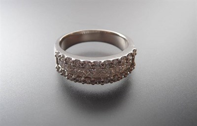 Lot 354 - A Diamond Three Row Half Eternity Ring, a row of channel set princess cut diamonds sits between two