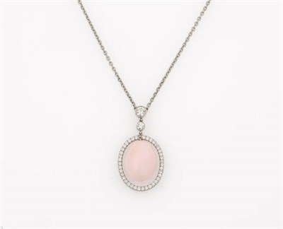 Lot 355 - A Conch Pearl and Diamond Pendant on Chain, the oval conch pearl suspends within a diamond frame to