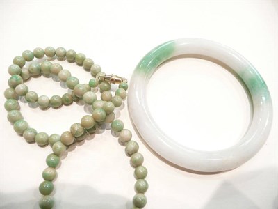 Lot 343 - A jade bracelet and necklace