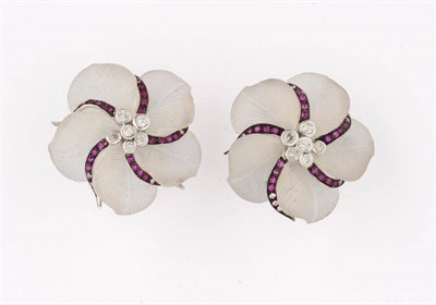 Lot 358 - A Pair of Rock Crystal Flower Earrings, carved rock crystal petals are spaced by pink sapphire...