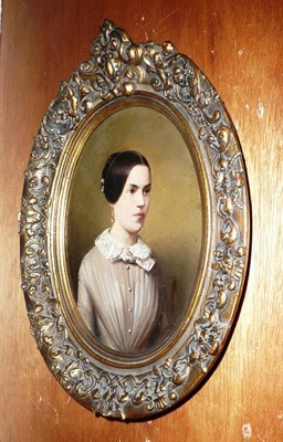 Lot 389 - Continental School (19th century), Portrait of a Young Lady, half length, wearing a grey dress with