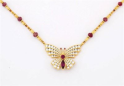 Lot 361 - A Diamond and Ruby Butterfly Necklace, by Kutchinsky, a stylised butterfly set with round brilliant