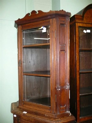 Lot 430 - An Edwardian walnut glazed hanging corner cupboard