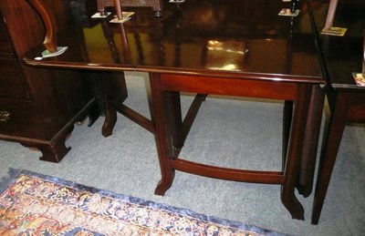 Lot 450 - Mahogany drop-leaf dining table