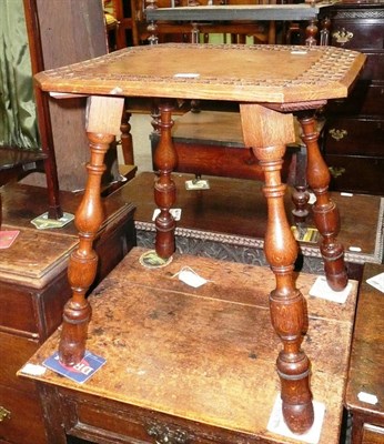 Lot 468 - A carved oak side table