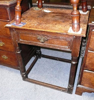 Lot 469 - An early 18th century oak side table, the rectangular top fitted with single moulded frieze drawer