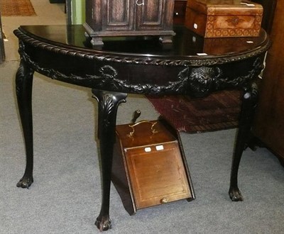 Lot 482 - An early 20th century ebonised mahogany console table