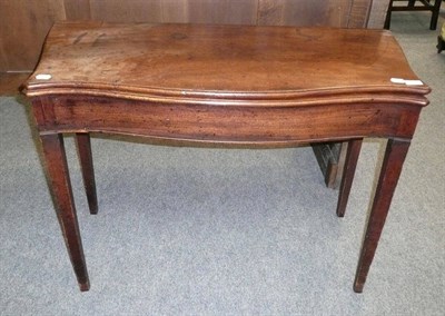 Lot 484 - A George III mahogany fold over tea table (in need of restoration)