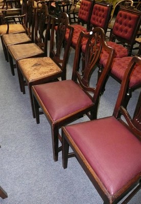 Lot 494 - Seven late George III mahogany dining chairs including one carver